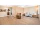 Living room with laminate wood flooring and neutral decor at 4880 Locust Ne St # 227, St Petersburg, FL 33703