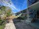 Building exterior with stairs and surrounding landscaping at 4902 31St S Ave # 109, Gulfport, FL 33707