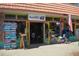 Quaint shop exterior with an American flag and bicycle at 4902 31St S Ave # 109, Gulfport, FL 33707