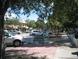 A street with parked cars and a park bench at 4902 31St S Ave # 109, Gulfport, FL 33707