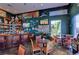 Nautical-themed bar with a full bar, seating, and TVs at 5176 Se Salmon Se Dr # D, St Petersburg, FL 33705