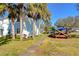 Side view of community building with lush landscaping at 5176 Se Salmon Se Dr # D, St Petersburg, FL 33705