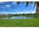 Serene community lake with a central fountain at 5176 Se Salmon Se Dr # D, St Petersburg, FL 33705