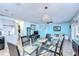 Bright dining area with glass table and seating for six at 5176 Se Salmon Se Dr # D, St Petersburg, FL 33705