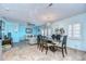 Bright dining area with glass table and seating for six at 5176 Se Salmon Se Dr # D, St Petersburg, FL 33705