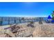 Relaxing waterfront patio with chairs and a dock at 5176 Se Salmon Se Dr # D, St Petersburg, FL 33705
