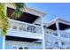 Two-story building with private balconies and white railings at 5176 Se Salmon Se Dr # D, St Petersburg, FL 33705