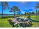 Community fire pit area with seating at 5176 Se Salmon Se Dr # D, St Petersburg, FL 33705