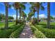 Lovely walkway lined with palm trees and lush landscaping at 5176 Se Salmon Se Dr # D, St Petersburg, FL 33705