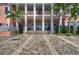 Ground-level patio with stairs leading to second-floor balcony at 5176 Se Salmon Se Dr # D, St Petersburg, FL 33705