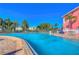 Resort-style pool with brick deck and lounge chairs at 5176 Se Salmon Se Dr # D, St Petersburg, FL 33705