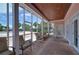 Relaxing screened porch with comfy seating overlooking the pool at 5176 Se Salmon Se Dr # D, St Petersburg, FL 33705