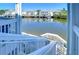 Steps leading down to waterfront with boat and water views at 5176 Se Salmon Se Dr # D, St Petersburg, FL 33705