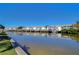 Community view of canal with boats and clear blue skies at 5176 Se Salmon Se Dr # D, St Petersburg, FL 33705
