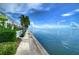 Walkway along the water with lush tropical landscaping at 5176 Se Salmon Se Dr # D, St Petersburg, FL 33705