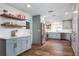 Modern kitchen with light blue cabinets, white countertops, and wood flooring at 5321 Dover Ne St, St Petersburg, FL 33703