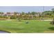 Golf course landscape with pond and distant cityscape at 6104 Palma Del Mar S Blvd # 404, St Petersburg, FL 33715