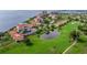 Aerial view of waterfront condo with golf course and pond at 6104 Palma Del Mar S Blvd # 404, St Petersburg, FL 33715