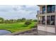 Building exterior and surrounding golf course view at 6104 Palma Del Mar S Blvd # 404, St Petersburg, FL 33715