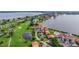 Condo building situated near a golf course and body of water at 6104 Palma Del Mar S Blvd # 404, St Petersburg, FL 33715
