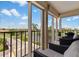 Private balcony with wicker furniture and golf course views at 6104 Palma Del Mar S Blvd # 404, St Petersburg, FL 33715
