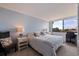 Bright bedroom with large window, ensuite bath, and built in desk at 6104 Palma Del Mar S Blvd # 404, St Petersburg, FL 33715