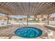 Relax in the community hot tub under a pergola at 6104 Palma Del Mar S Blvd # 404, St Petersburg, FL 33715