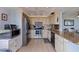 Modern kitchen with stainless steel appliances and granite countertops at 6104 Palma Del Mar S Blvd # 404, St Petersburg, FL 33715