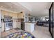 Open concept kitchen with breakfast bar overlooking living room at 6104 Palma Del Mar S Blvd # 404, St Petersburg, FL 33715