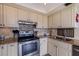 Well-equipped kitchen featuring stainless steel appliances and granite countertops at 6104 Palma Del Mar S Blvd # 404, St Petersburg, FL 33715