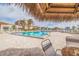 Enjoy the resort-style pool with thatch umbrellas at 6104 Palma Del Mar S Blvd # 404, St Petersburg, FL 33715