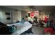 Bedroom with bed, desk and eclectic decor at 6947 Bottle Brush Dr, Port Richey, FL 34668