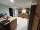 Kitchen with granite countertops and wood cabinets at 6947 Bottle Brush Dr, Port Richey, FL 34668