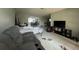 Living room with sofa and view into kitchen at 6947 Bottle Brush Dr, Port Richey, FL 34668