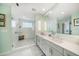 Spa-like bathroom with a walk-in shower and double vanity at 920 N Osceola Ave # 702, Clearwater, FL 33755