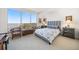Bright bedroom with water views, featuring a comfortable bed and sitting area at 920 N Osceola Ave # 702, Clearwater, FL 33755