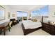 Main bedroom with water views, a king-size bed, and a desk at 920 N Osceola Ave # 702, Clearwater, FL 33755