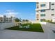 Relaxing courtyard with artificial turf, seating, and cornhole at 920 N Osceola Ave # 702, Clearwater, FL 33755