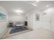 Bright and airy den with comfortable seating and a large rug at 920 N Osceola Ave # 702, Clearwater, FL 33755