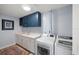 Convenient laundry room with washer, dryer, and extra storage at 920 N Osceola Ave # 702, Clearwater, FL 33755