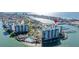 Aerial view of waterfront condo building with pool and marina at 9525 Blind Pass Rd # 507, St Pete Beach, FL 33706