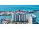 Aerial view showcasing condo building and water access at 9525 Blind Pass Rd # 507, St Pete Beach, FL 33706