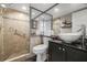 Updated bathroom with walk-in shower and modern vanity at 9525 Blind Pass Rd # 507, St Pete Beach, FL 33706