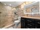 Updated bathroom with a walk-in shower and modern vanity at 9525 Blind Pass Rd # 507, St Pete Beach, FL 33706