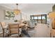 Open concept dining area with hardwood floors and water views at 9525 Blind Pass Rd # 507, St Pete Beach, FL 33706