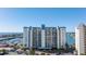 Building exterior overlooking marina and water at 9525 Blind Pass Rd # 507, St Pete Beach, FL 33706