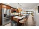 Modern kitchen with stainless steel appliances and island at 9525 Blind Pass Rd # 507, St Pete Beach, FL 33706