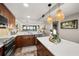 Modern kitchen featuring updated cabinetry and quartz countertops at 9525 Blind Pass Rd # 507, St Pete Beach, FL 33706