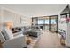 Relaxing living room featuring water views and fireplace at 9525 Blind Pass Rd # 507, St Pete Beach, FL 33706