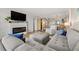 Spacious living room with sectional sofa and fireplace at 9525 Blind Pass Rd # 507, St Pete Beach, FL 33706